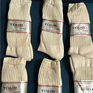 6 Pair of Men’s golf socks.  New in package.